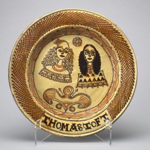 Charger: Charles II and Catherine of Braganza, made by Thomas Toft (d. 1689), in Staffordshire, England, c. 1662–85. Earthenware, decorated with slip, glazed